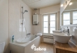 Licht op te frissen woning op een ruim perceel te centrum Roeselare!