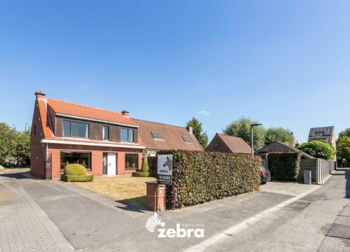 Halfopen bebouwing met 4 slaapkamers op een ruim perceel te Wevelgem!